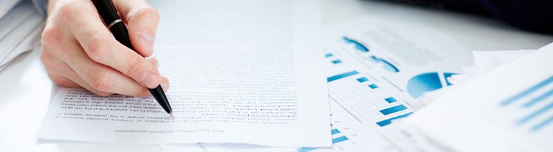 Business professionals signing an engagement letter